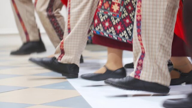 The legs of dancers in national Armenian costumes are without faces. national dances.