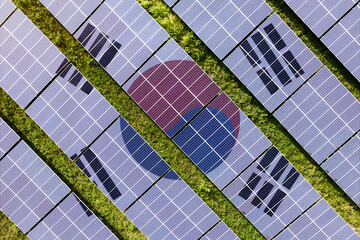 Solar farm superimposed with flag of South Korea. Symbolizing solar power and panel demand, renewable energy industry, government policy, and sustainability initiatives in the country.