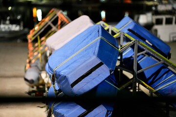 Packed in blue covers lifeboats at the seaport on special racks.