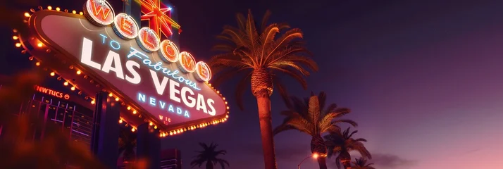 The famous Welcome to Fabulous Las Vegas sign illuminated against a dusky sky, surrounded by tall palm trees and vibrant lights.