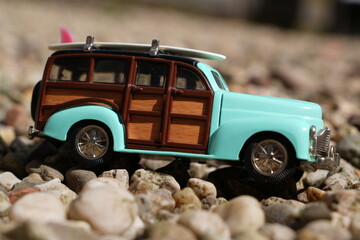 Toy car riding with surfboard 