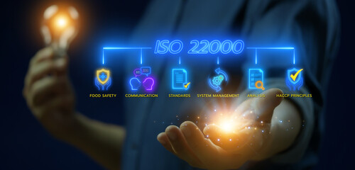 ISO 22000. International Organization for Standardization sign and symbol. Food safety standard. Businessman using smartphone to show glowing neon line of ISO 22000 banner icons on virtual screen.