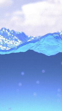 Beautiful clear rippled water surface splash rising. Light blue underwater that fills the screen. Slow motion close-up from the bottom of sea to the sky. Longitudinal view of the wavy ocean. Vertical