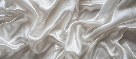 Obraz premium Background of white silk fabric with ample copy space image
