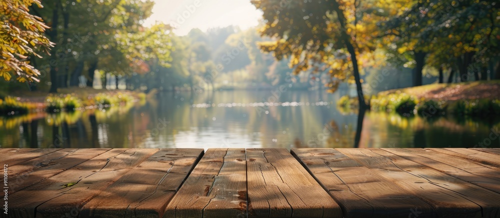 Sticker Wooden table displaying a blur of lake and park scenery in the background forming a serene copy space image to showcase products