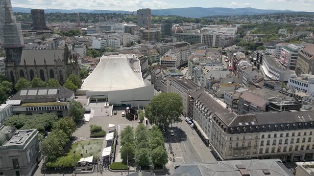 4K Drone Video of Trains and Basel, Switzerland with Historic Buildings, Gothic Churches, and Modern Opera House (Pan Right)