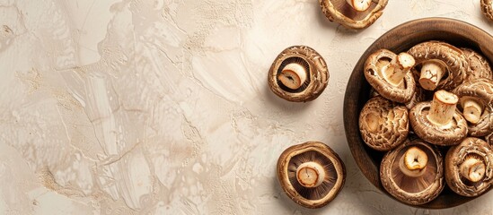 Dried shiitake mushrooms displayed on a table with a food background for a top view copy space image suitable for vegetarian or vegan diets