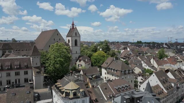 4K Drone Video of Rooftops of Historic Churches and Homes in downtown Basel, Switzerland (Truck Left)