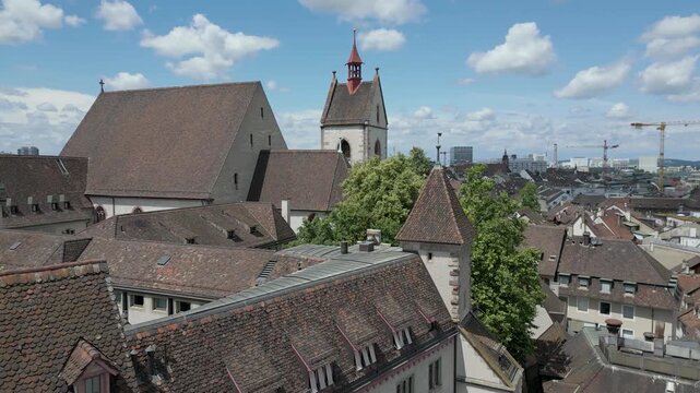 4K Drone Video of Rooftops of Historic Homes and Bell Towers of Churches in downtown Basel, Switzerland (Truck Left)