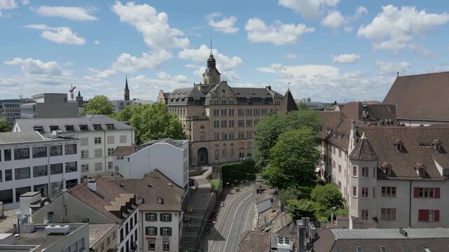 4K Drone Video of Historic Churches, Buildings, and Construction Cranes in downtown Basel, Switzerland (Truck Right)