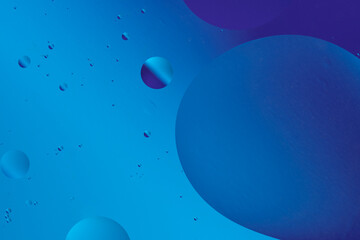 Abstract blue bubbles and shapes flow together, creating a tranquil, smooth pattern resembling liquid or underwater scenes.