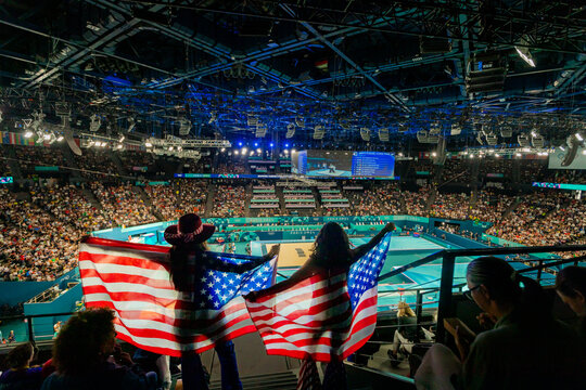 Patriotic American Women cheering on team usa gymnastics at the Paris 2024 Olympics, Bercy Arena, Paris, France, Europe - Powered by Adobe