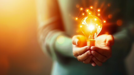 Illuminating Ideas A Light Bulb Held in Hands Symbolizing Innovation, Creativity, and the Spark of New Possibilities in Life