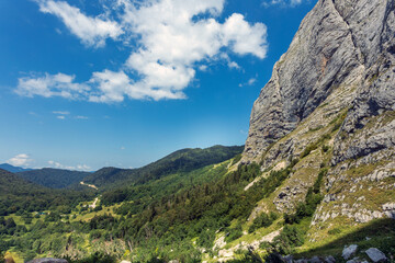 Natural landscape of mountains and green forest. Travel and adventure concept image.