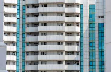 many windows and walls facade of a modern skyscraper without people