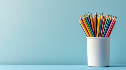 School and learning banner, light blue background, back to school, stationery cup with colored pencils, notebook, and textbooks, copy space