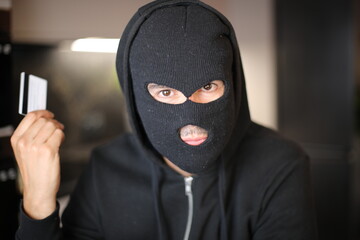 Unrecognisable man hoilding credit card 