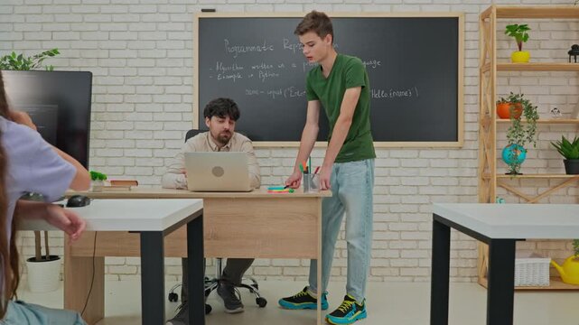 Student Leading a Discussion on Python Programming in Classroom