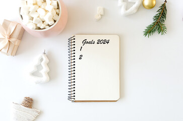 Fototapeta premium New year resolution concepts. 2024 goals or plans list with notebook,