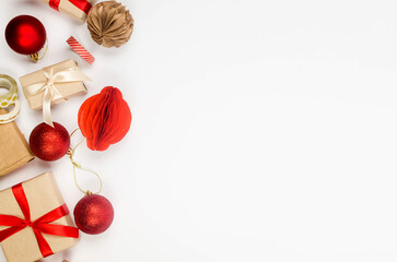 Christmas background with gift boxes red baubles and ribbon