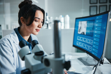 Computer screen, review and science with woman in laboratory for development, innovation or...
