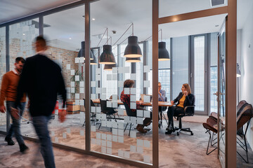 In the dynamic hustle and bustle of a business environment, a group of young business professionals...