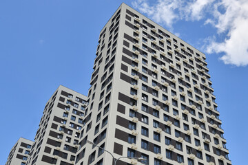 Obraz premium Modern new residential building with air conditioner baskets on facades, Russia