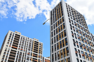 Obraz premium Modern new residential building with air conditioner baskets on facades, Russia
