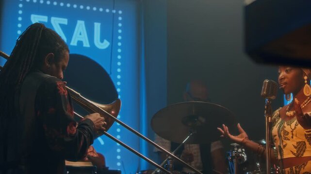Four members of jazz band giving concert in bar, female vocalist singing, three males playing conga, drums and trombone