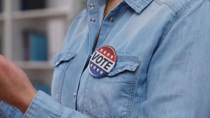 Active citizen with a vote button campaigning for a political party before elections