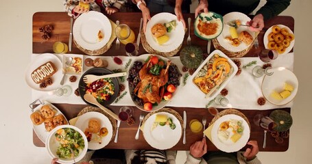 Hands, family and people on dinner for thanksgiving celebration and reunion with meal. Above, food and salad on table at home to feast with gathering, support and care for sharing, love and unity - Powered by Adobe
