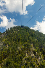 Velika Planina, Kamnik, Slovenia. Lord of the Rings style village. Wooden typical houses, hills, green meadows, flowers where cows and calfs graze. High quality artisanal milk and cheeses. Holiday.