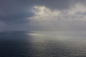Clearing storm over vast ocean at dusk, Oregon