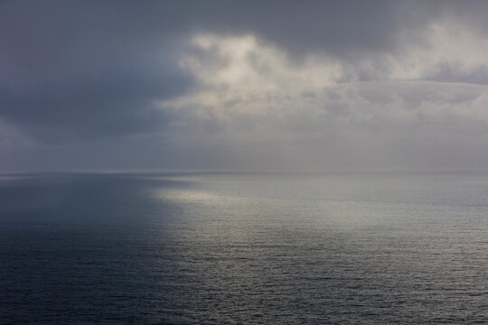 Clearing storm over vast ocean at dusk, Oregon