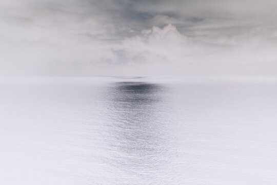 Abstract of clearing storm over vast ocean at dusk, Oregon