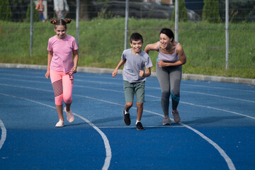 girl runs, runner, teenager, children's sports, runner, family engaged in sports, workout, warm-up, girl runs, woman runs, sports, treadmill, boy runs, happiness, childhood, happy family, funny boy