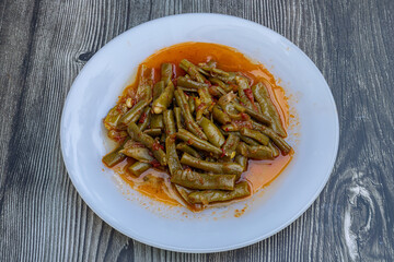 Traditional delicious Turkish food; Green beans with olive oil; Turkish name; Zeytinyagli taze fasulye