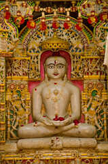 Fototapeta premium An idol of Lord Mahavir in Jain Temple, Jaisalmer Fort, Jaisalmer, Rajasthan, India, Asia.