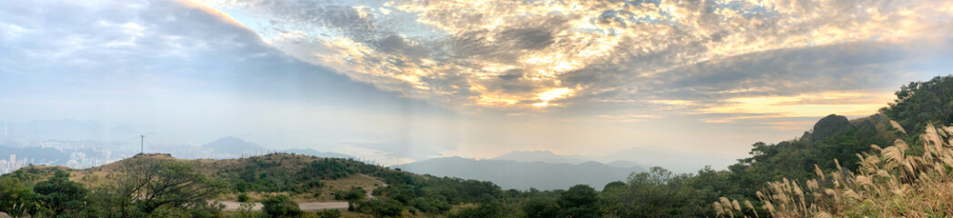 Panorama of natural outdoor background, blue sky, mountains, ocean