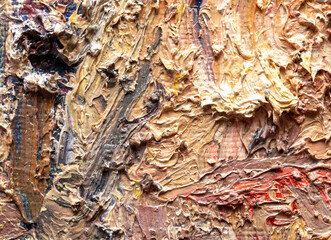 Orange-yellow-red oil paints applied with a spatula to canvas. Abstract background