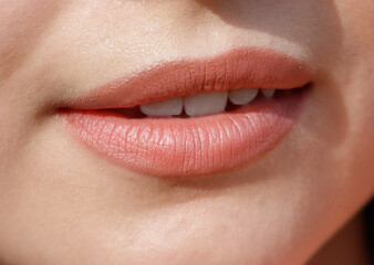 Naklejka premium Close-up of lips on a girl's face. Macro