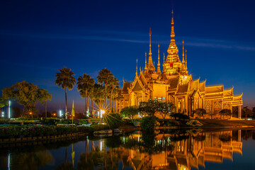 Naklejka premium The beautiful temple made from marble and cement in nighttime with water reflection at Sikhio landmark Nakhon ratchasima, thailand