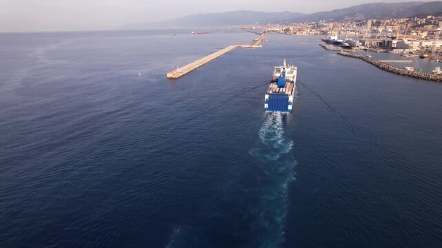 Cargo Ship Arrives at Port of Genoa Delivering Containers on a Sunny Day