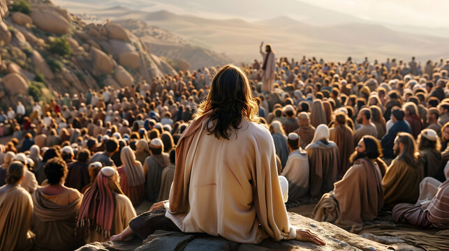 Jesus sat on a rock preaching to a large crowd on the mountain. The crowd looked at Jesus' face and listened intently to His teachings. From the back view of Jesus