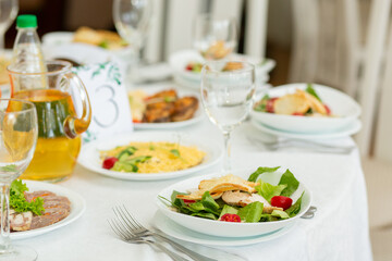 Wedding banquet in restaurant, covered round table for guests