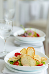 Wedding banquet in restaurant, covered round table for guests