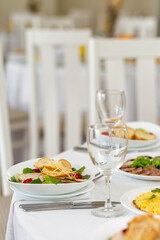 Wedding banquet in restaurant, covered round table for guests