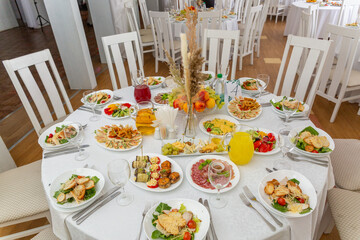 Wedding banquet in restaurant, covered round table for guests