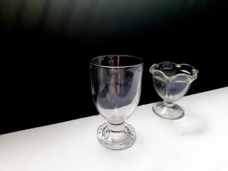 Aesthetic of transparent glasses for drink events with lines of sun shadow and glare on isolated background