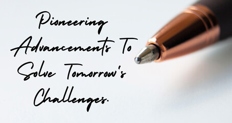 Pioneering advancements to solve tomorrow's challenges text with close up pen background. Business...